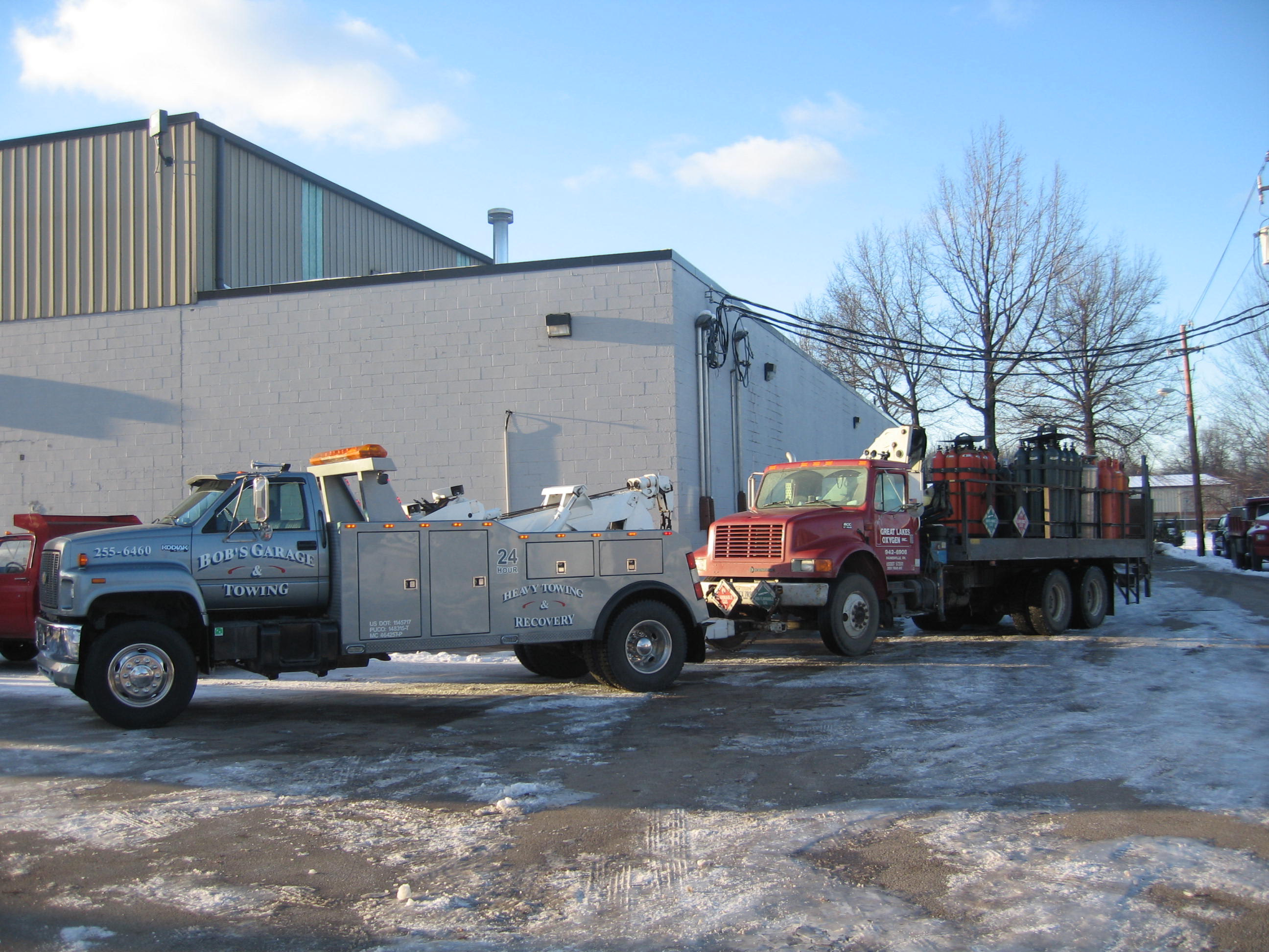 Our Heavy-Duty truck towing a tandem straight truck